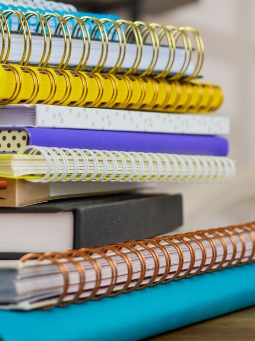 Back-to-school supplies and a backpack, illustrating how to save money on back-to-school shopping in 2026