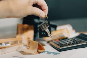 Roommates reviewing shared household bills and expenses together at a table