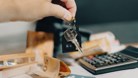 Roommates reviewing shared household bills and expenses together at a table