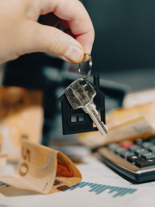 Roommates reviewing shared household bills and expenses together at a table