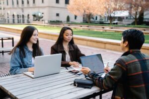 College student managing finances on a laptop before the fall semester