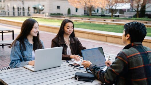 College student managing finances on a laptop before the fall semester