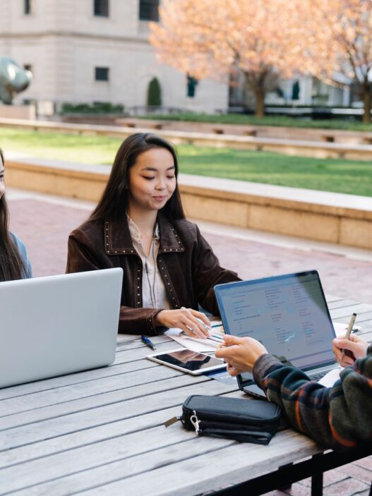 College student managing finances on a laptop before the fall semester