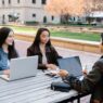 College student managing finances on a laptop before the fall semester
