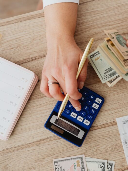 Person reviewing a utility bill and budgeting monthly payments at home
