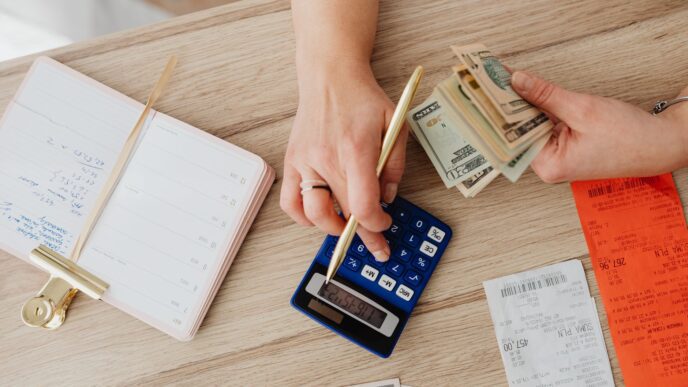 Person reviewing a utility bill and budgeting monthly payments at home