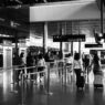 Travelers with luggage in an airport terminal during the holiday travel season