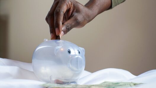 Certificate of deposit paperwork and savings account statement on a desk