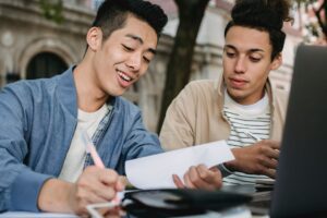 College student reviewing a tuition and fees bill before fall semester