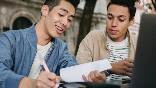 College student reviewing a tuition and fees bill before fall semester