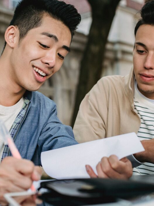 College student reviewing a tuition and fees bill before fall semester