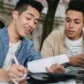 College student reviewing a tuition and fees bill before fall semester