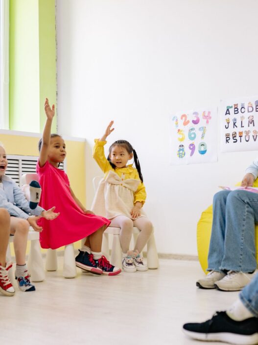 Young children and a caregiver in a daycare classroom