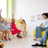 Young children and a caregiver in a daycare classroom
