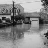 Floodwater covering a residential street outside homes