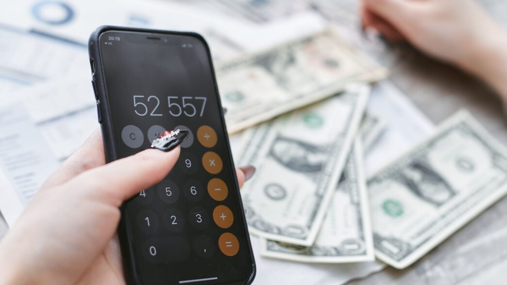 Person reviewing a cell phone bill on a smartphone