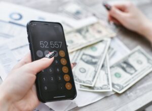 Person reviewing a cell phone bill on a smartphone