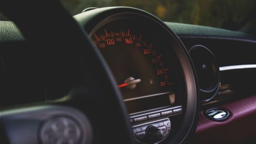 Car odometer and dashboard showing low mileage