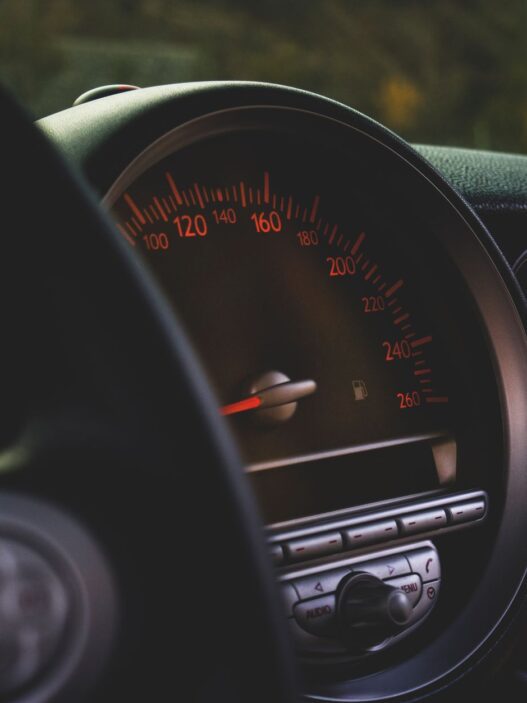 Car odometer and dashboard showing low mileage