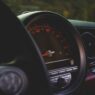 Car odometer and dashboard showing low mileage
