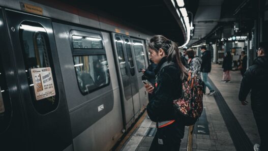 Commuters boarding a train at a station, representing pre-tax commuter benefits
