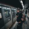 Commuters boarding a train at a station, representing pre-tax commuter benefits