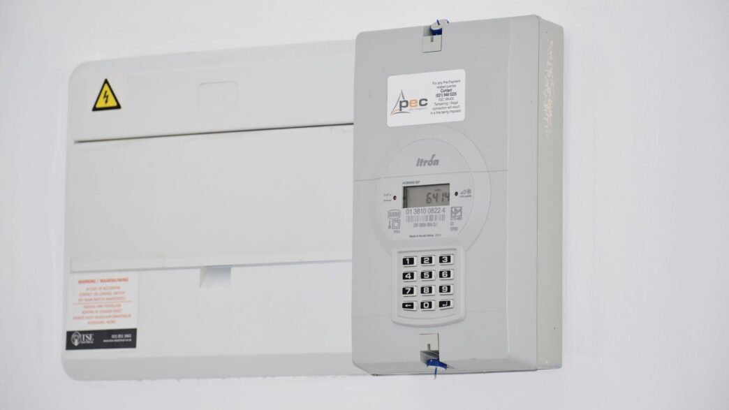 Residential electricity meter on the side of a house