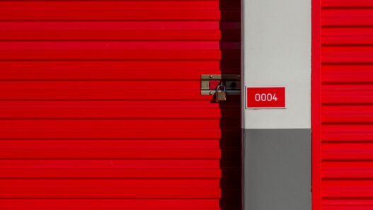 Row of orange self storage unit doors at a storage facility