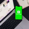 Person moving money between bank accounts on a phone