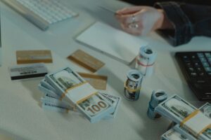 Credit card statements and a calculator on a desk while working out a balance transfer payoff