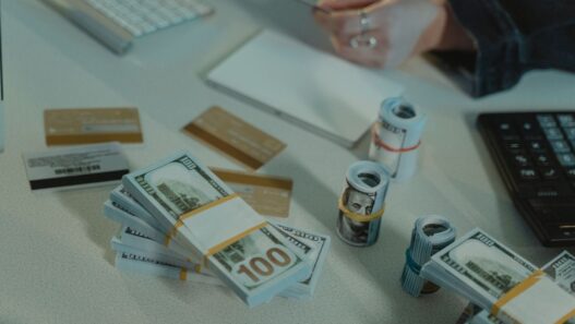 Credit card statements and a calculator on a desk while working out a balance transfer payoff