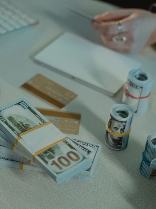 Credit card statements and a calculator on a desk while working out a balance transfer payoff