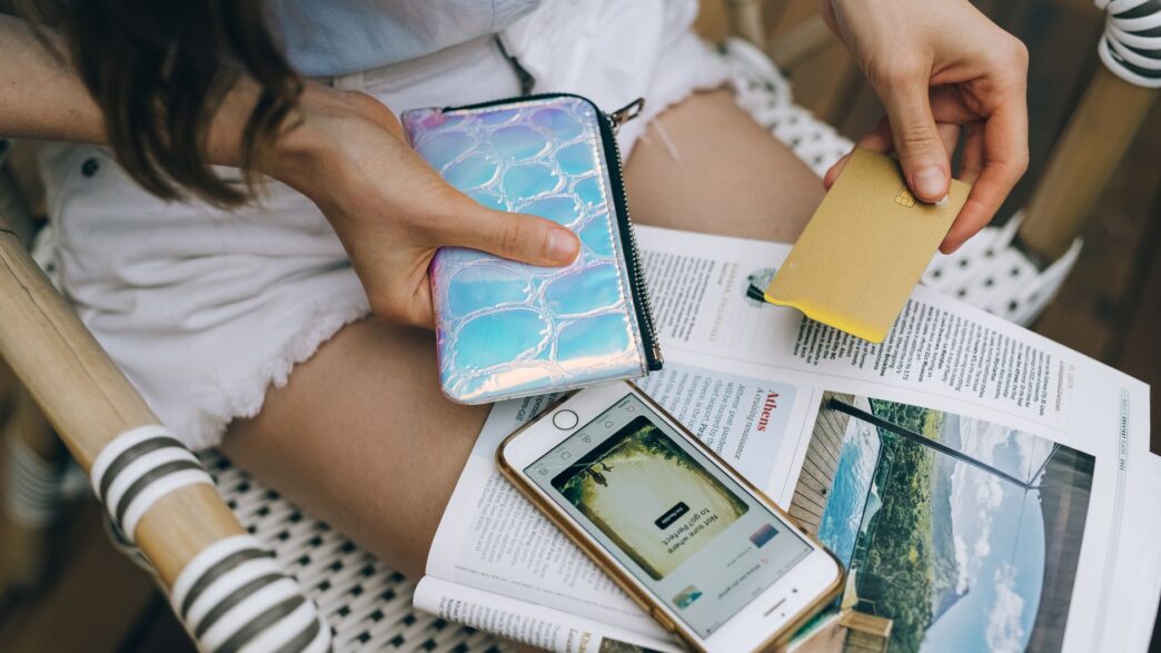 Credit cards and a smartphone on a table, used to check rewards balances