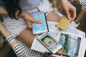 Credit cards and a smartphone on a table, used to check rewards balances