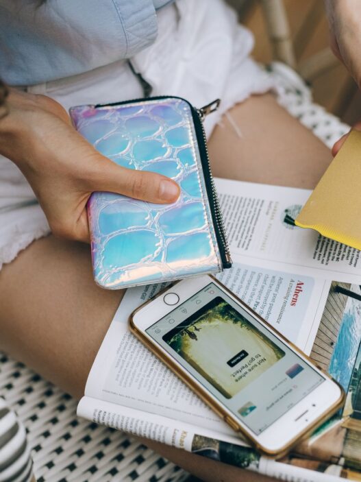 Credit cards and a smartphone on a table, used to check rewards balances