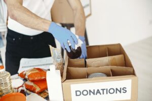 Volunteers sorting donated food at a community charity drive