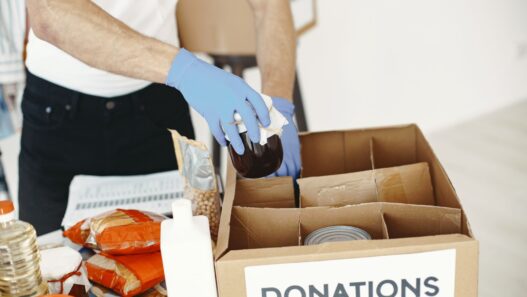 Volunteers sorting donated food at a community charity drive