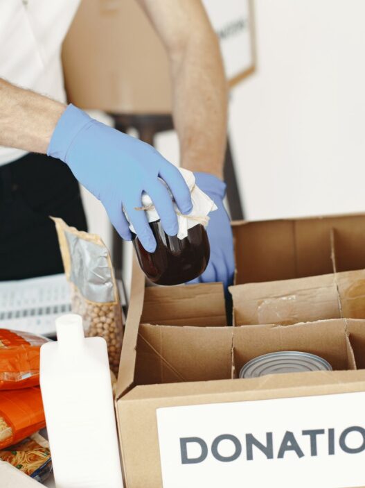 Volunteers sorting donated food at a community charity drive