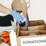 Volunteers sorting donated food at a community charity drive