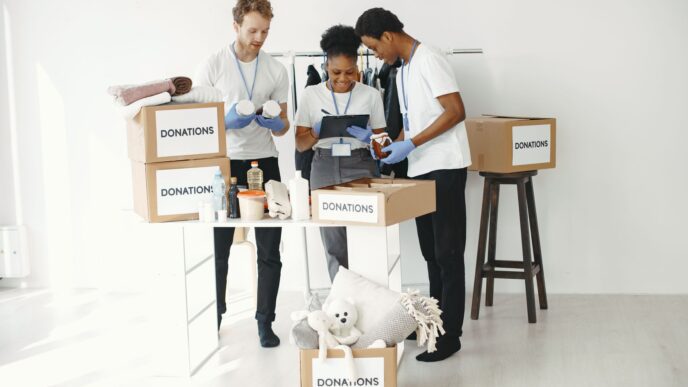 Volunteers sorting donated items at a charity donation drive