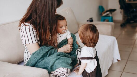 A family at home, illustrating how to compare dependent health coverage across two employer plans