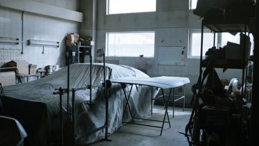 A vehicle being repaired in a body shop, illustrating the basis for a diminished value claim