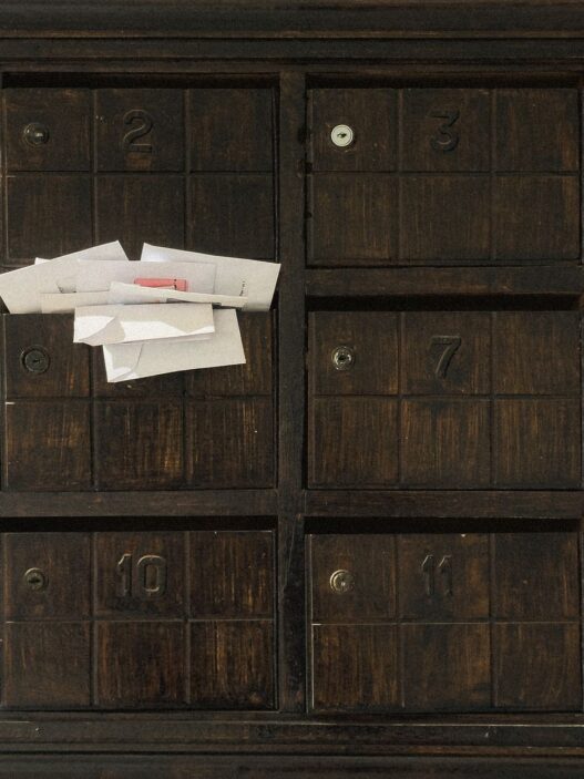 Unopened envelopes in a mailbox, illustrating unclaimed money held by states