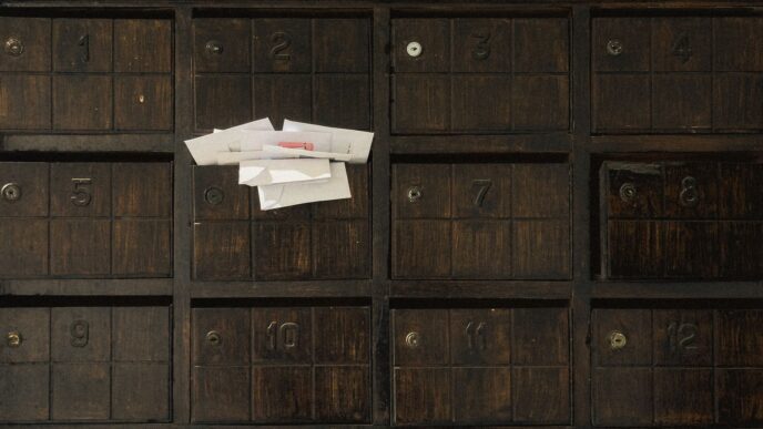 Unopened envelopes in a mailbox, illustrating unclaimed money held by states
