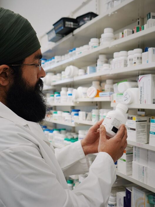 Over-the-counter medicine and health supplies on a pharmacy shelf
