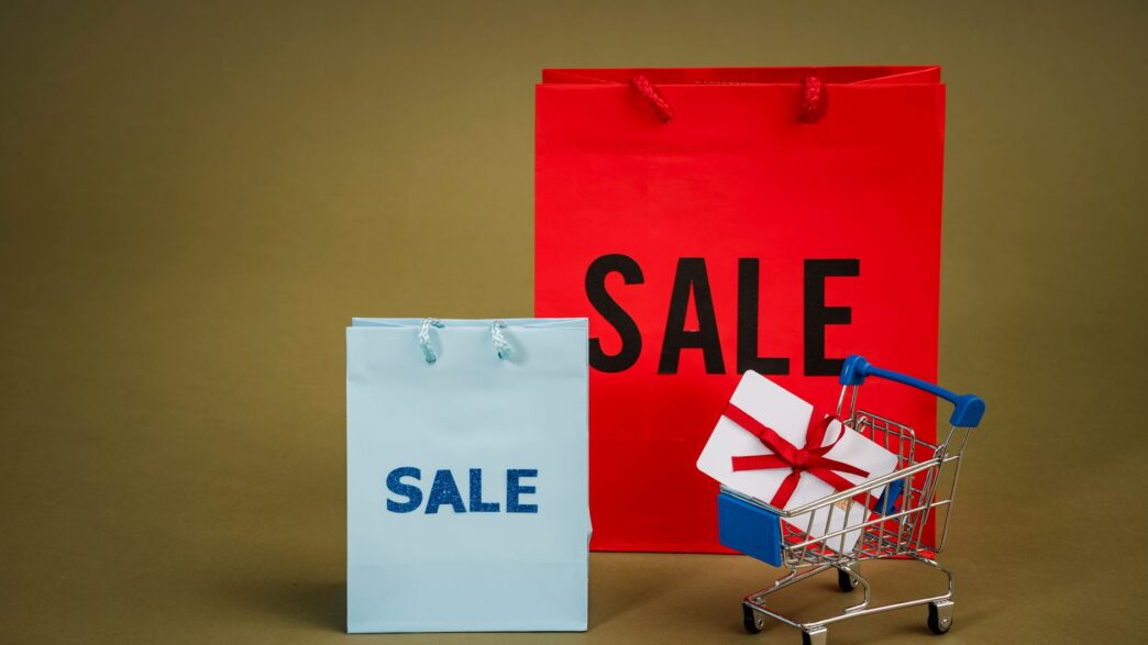 Shopper carrying holiday gift bags