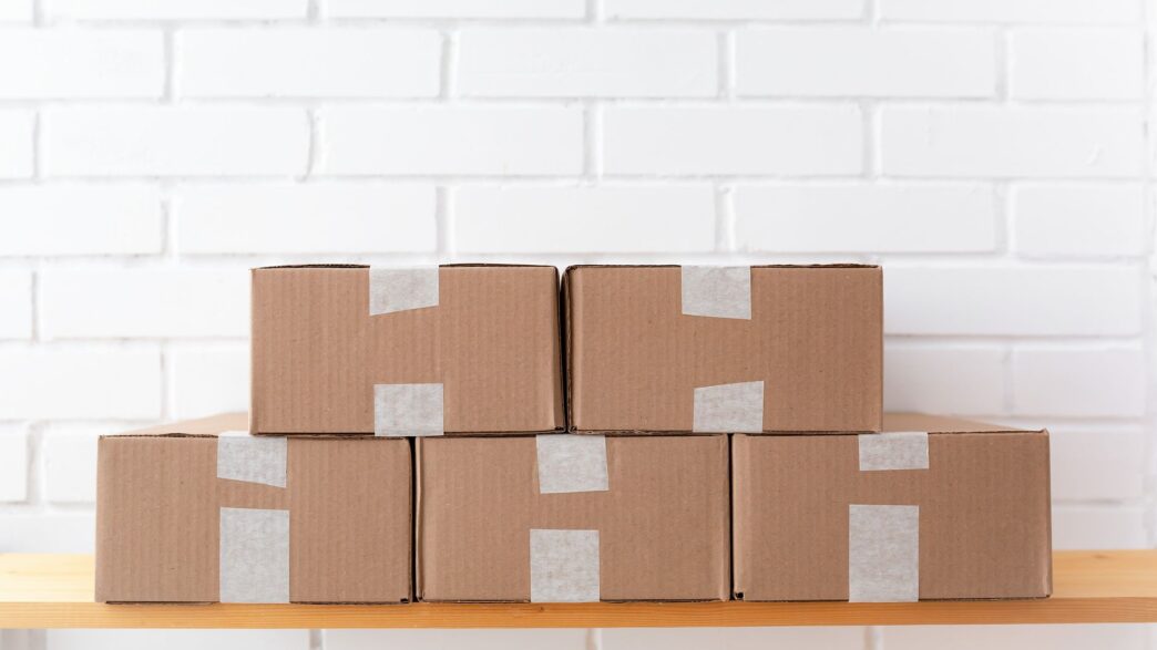 Cardboard shipping boxes and packing supplies ready to mail