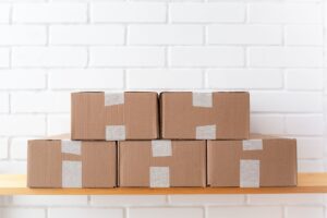 Cardboard shipping boxes and packing supplies ready to mail