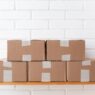Cardboard shipping boxes and packing supplies ready to mail