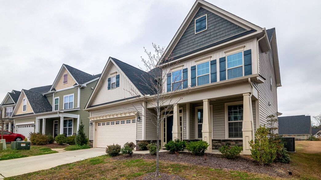 A suburban home exterior, illustrating homeowners insurance non-renewal and residual market options